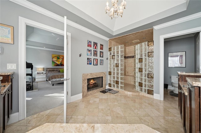 bathroom with a shower, crown molding, a chandelier, toilet, and vanity