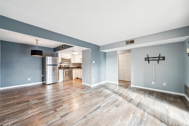 unfurnished living room featuring light wood-type flooring