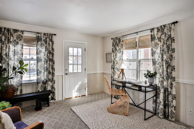 foyer entrance featuring carpet flooring