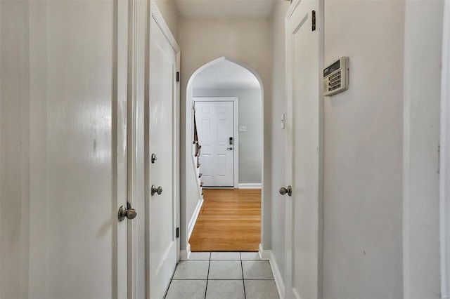 hallway with light tile patterned floors