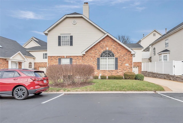 view of front property with a front lawn