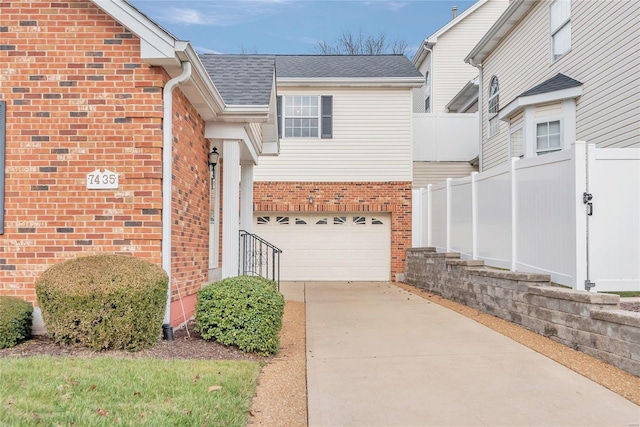 view of exterior entry with a garage