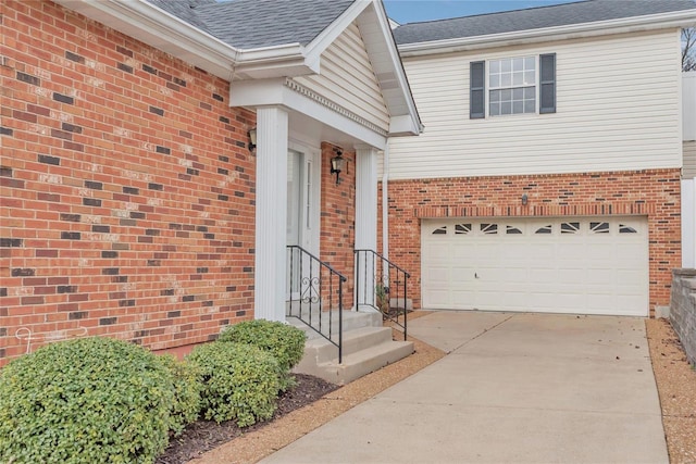 view of exterior entry featuring a garage