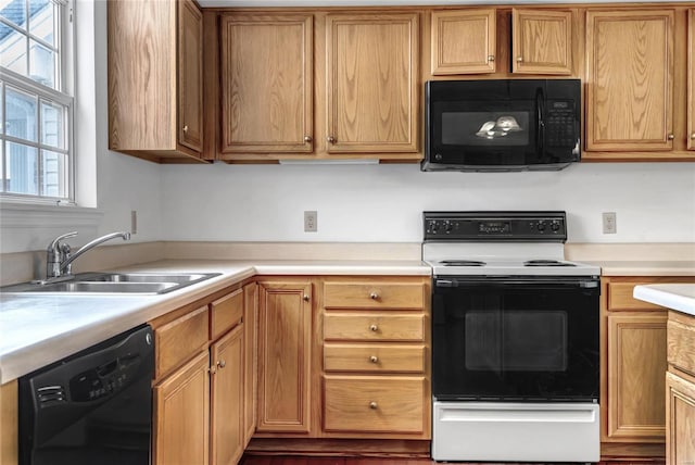 kitchen featuring sink and black appliances