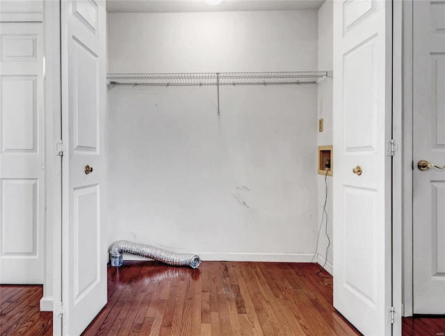 laundry room with wood-type flooring and hookup for a washing machine