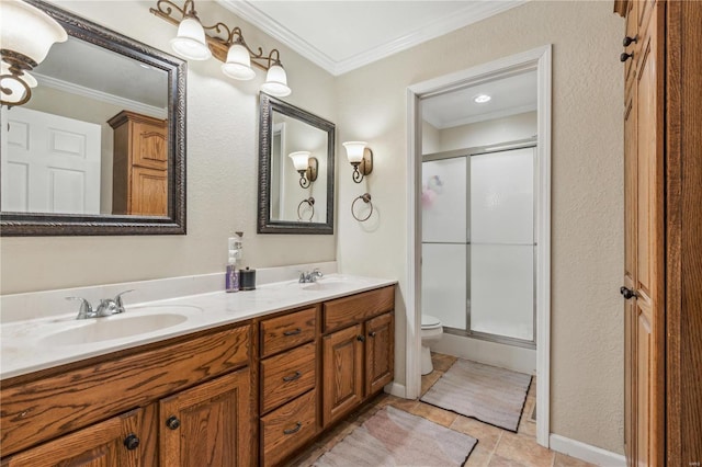 bathroom with crown molding, tile patterned flooring, a shower with shower door, and vanity