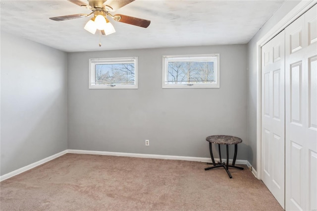 bedroom featuring light carpet, a closet, and ceiling fan