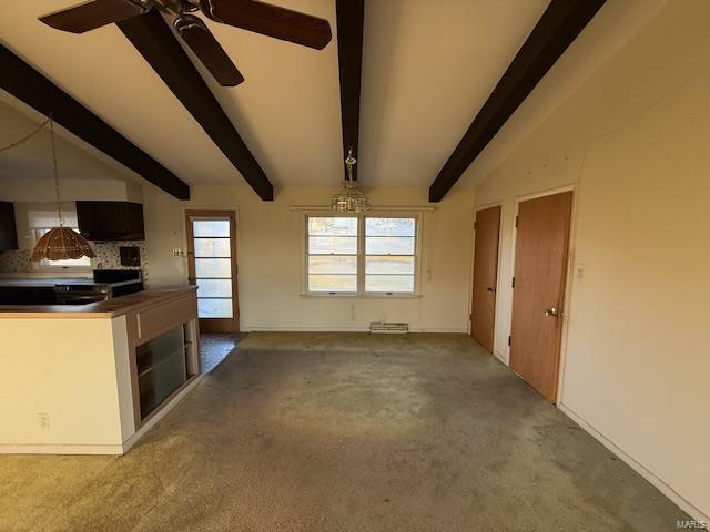 unfurnished living room featuring carpet flooring, lofted ceiling with beams, and ceiling fan