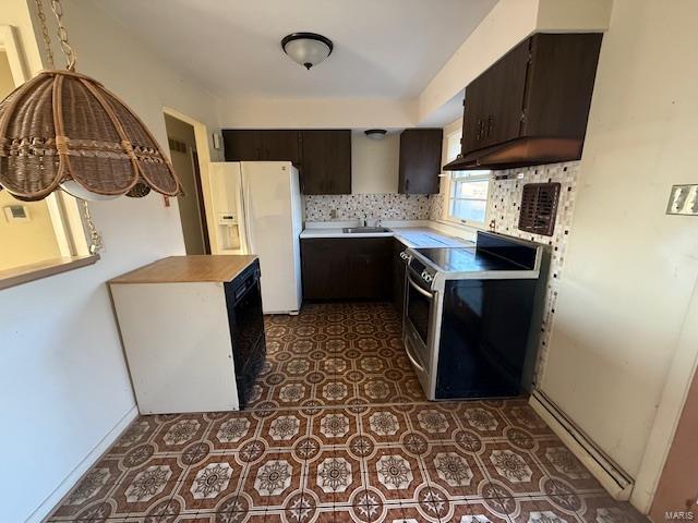 kitchen with stainless steel electric stove, dark brown cabinetry, white fridge with ice dispenser, and custom range hood