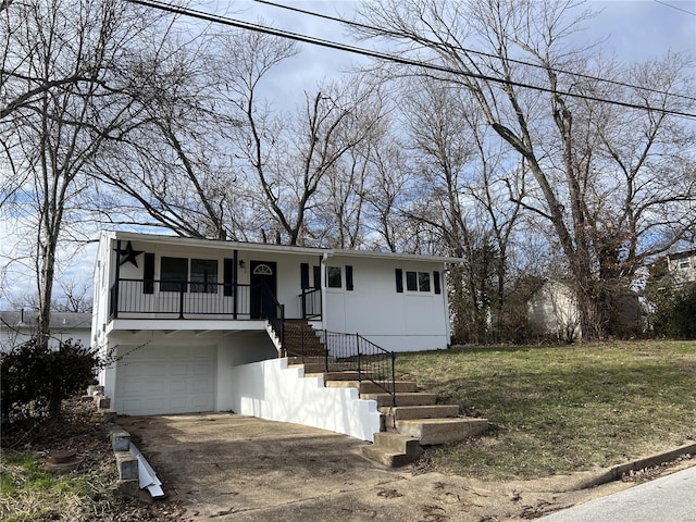 view of front facade with a front yard and a garage