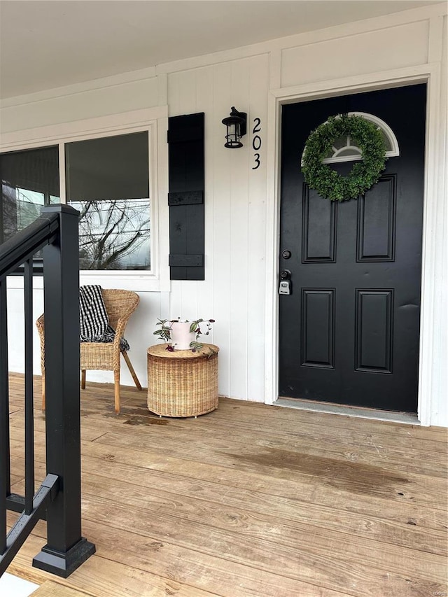 view of exterior entry featuring a porch