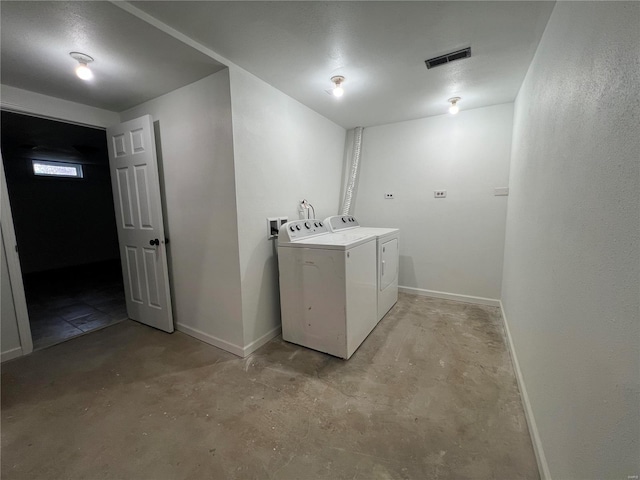 laundry room with separate washer and dryer