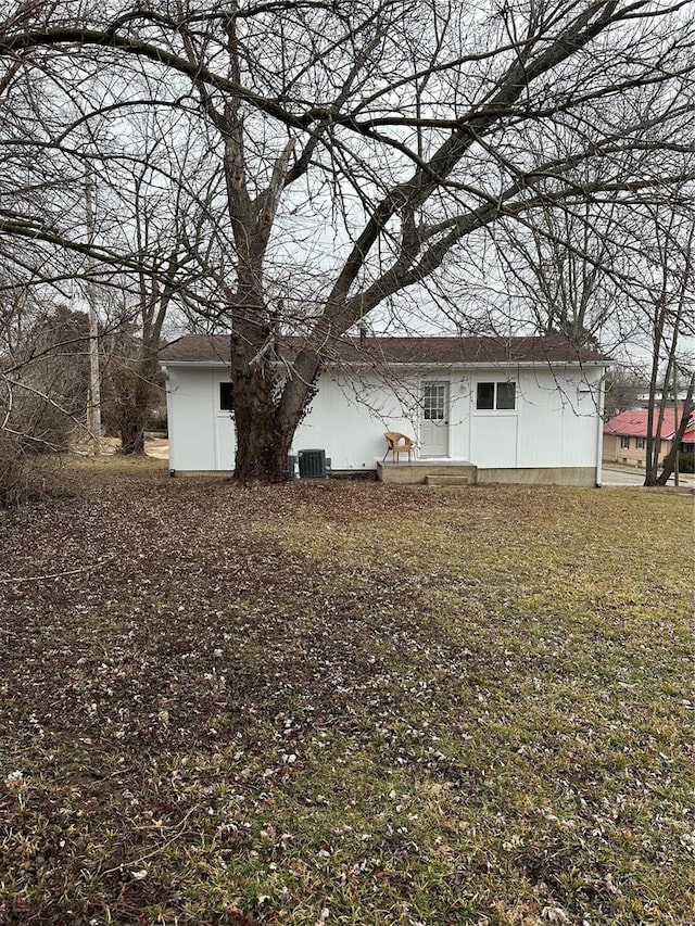 back of property with central AC