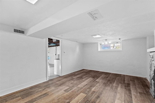 basement featuring hardwood / wood-style flooring