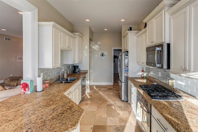 kitchen with white cabinetry, sink, and appliances with stainless steel finishes