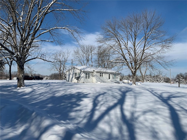 view of yard layered in snow