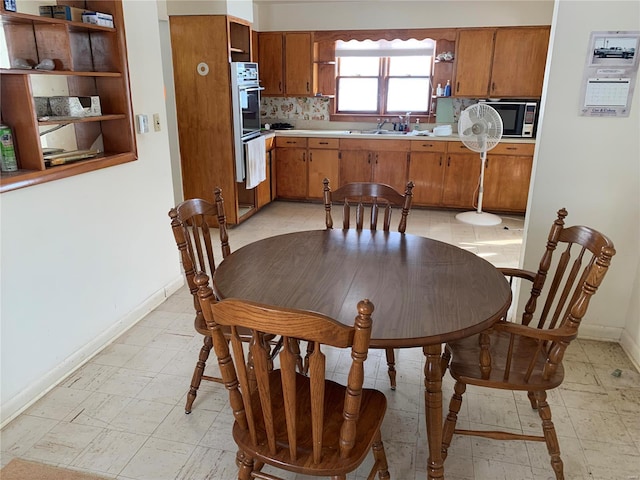 dining space featuring sink