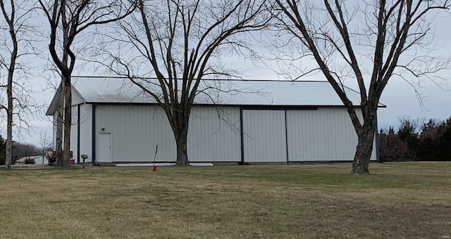 view of outdoor structure with a lawn