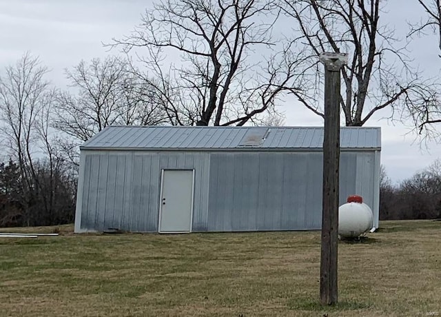 view of outbuilding with a lawn