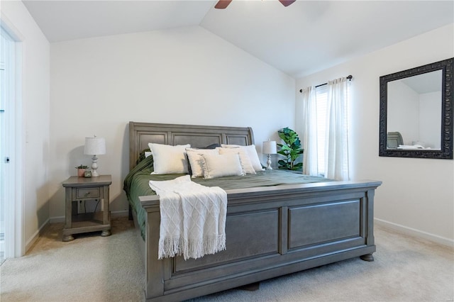 carpeted bedroom with lofted ceiling and ceiling fan