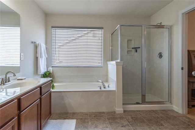 bathroom with vanity, shower with separate bathtub, and tile patterned floors