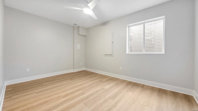 unfurnished room featuring light hardwood / wood-style flooring and ceiling fan