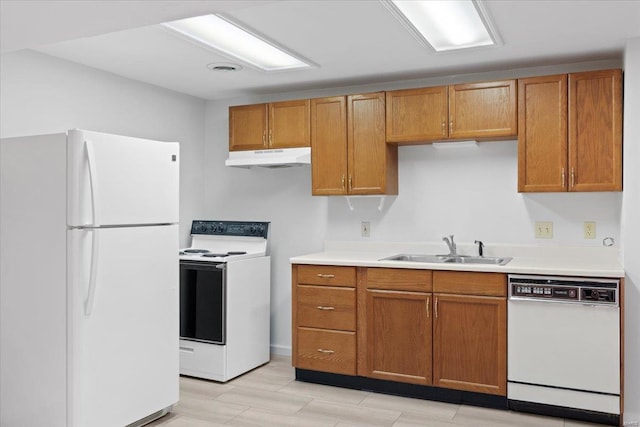 kitchen featuring sink and white appliances