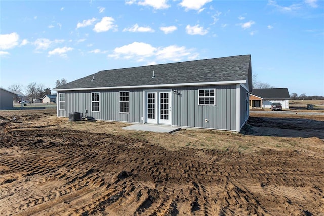 back of property with central AC and french doors