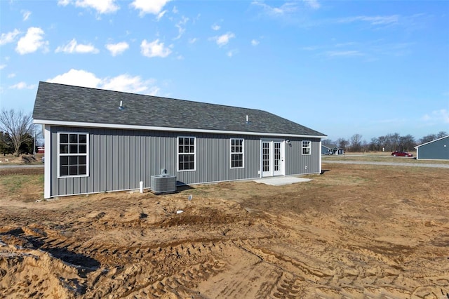 back of property with french doors and central air condition unit