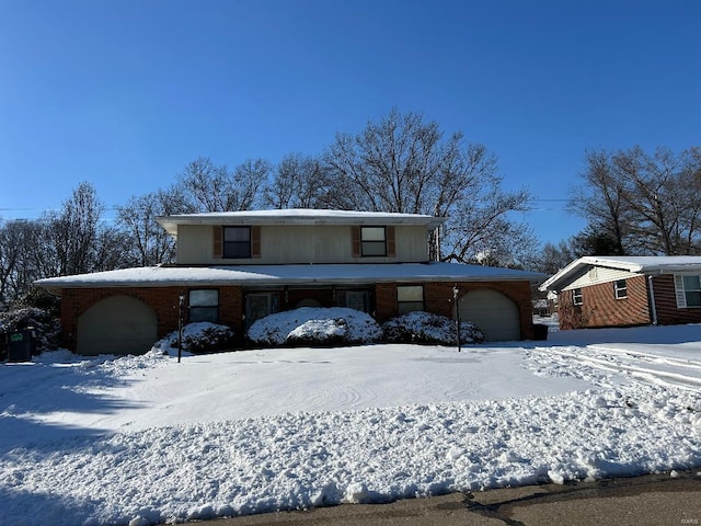 front facade with a garage