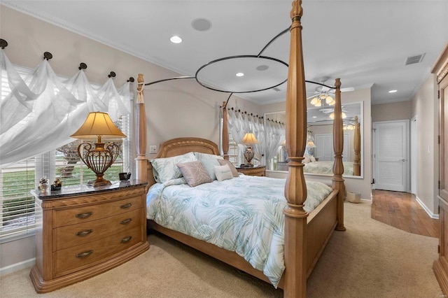 carpeted bedroom with ornamental molding