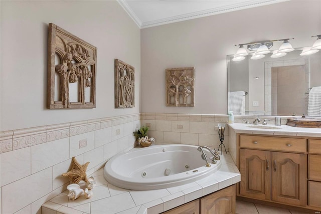 bathroom featuring tiled bath, crown molding, tile patterned flooring, and vanity