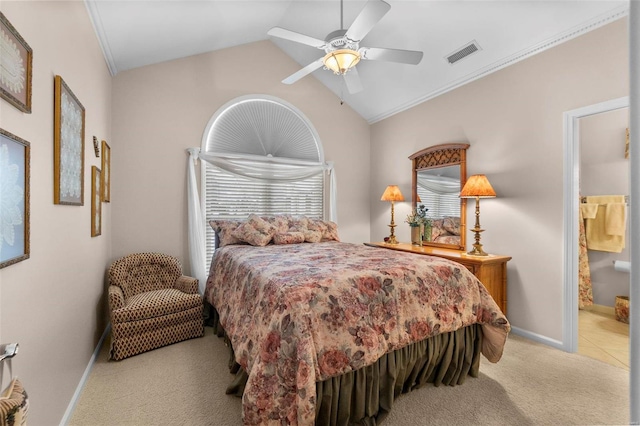 bedroom featuring ensuite bathroom, ceiling fan, lofted ceiling, and light colored carpet