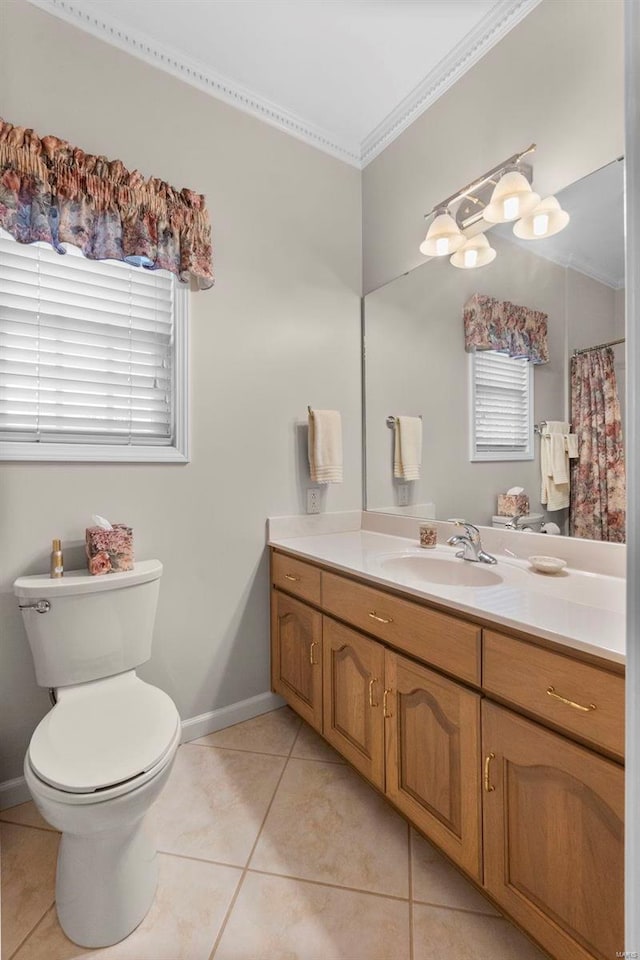 bathroom featuring tile patterned floors, vanity, toilet, and ornamental molding