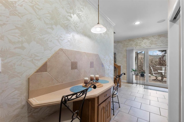 tiled dining space featuring ornamental molding