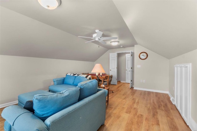 interior space with ceiling fan, light hardwood / wood-style floors, and lofted ceiling