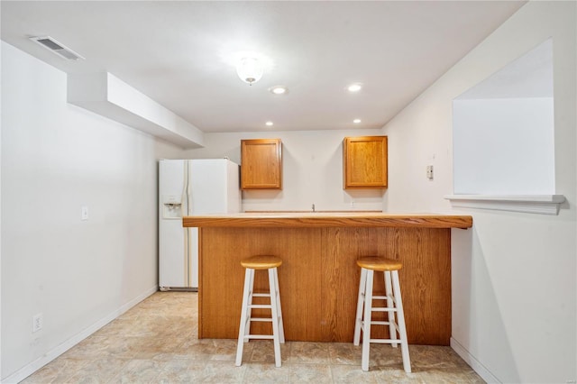 bar with white fridge with ice dispenser