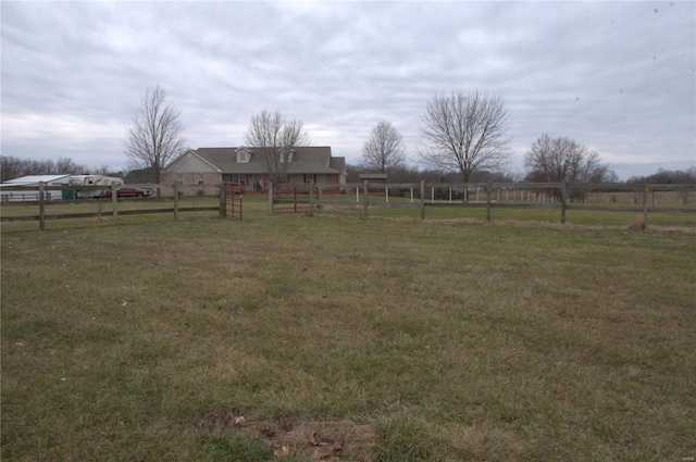 view of yard with a rural view