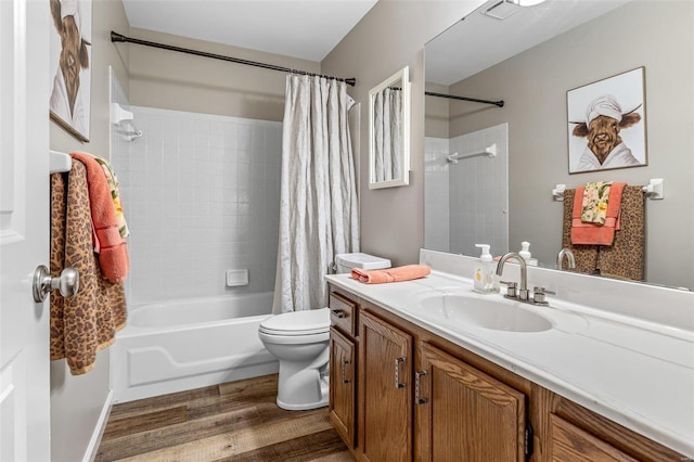 full bathroom featuring toilet, wood-type flooring, vanity, and shower / bath combination with curtain