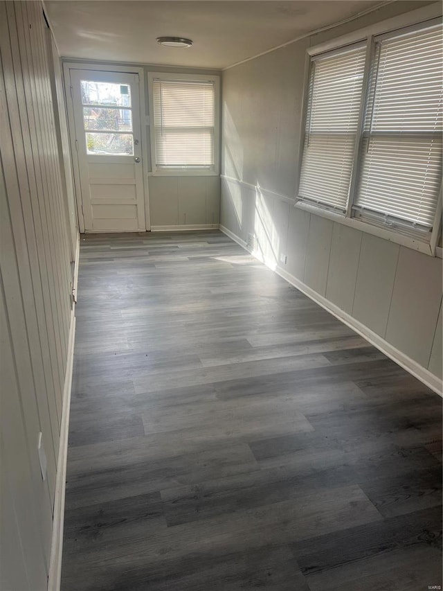 empty room featuring dark wood-type flooring