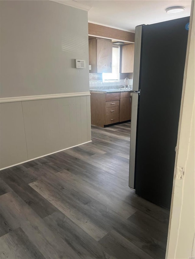 hall with dark hardwood / wood-style floors and sink