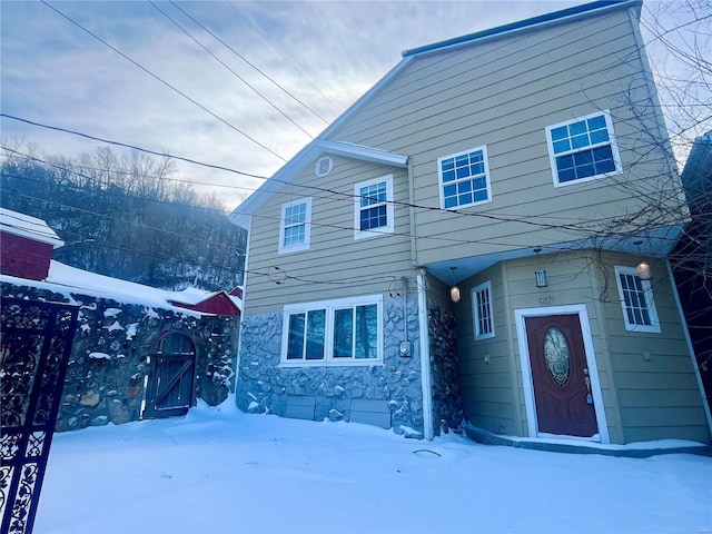 view of snow covered house