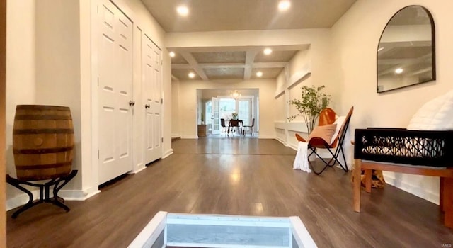 hall with dark hardwood / wood-style flooring, beamed ceiling, and coffered ceiling