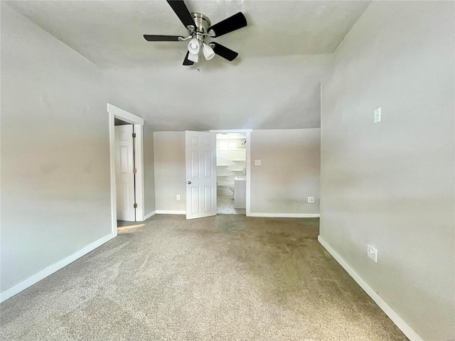 unfurnished living room with ceiling fan, carpet floors, and lofted ceiling