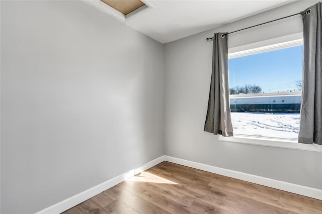 spare room featuring hardwood / wood-style flooring