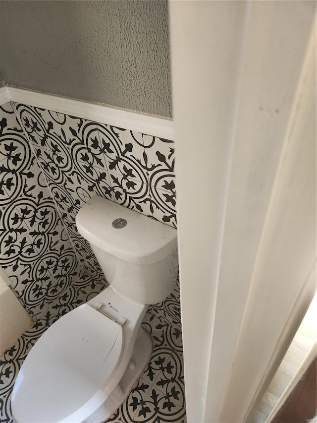 bathroom featuring tile patterned flooring and toilet