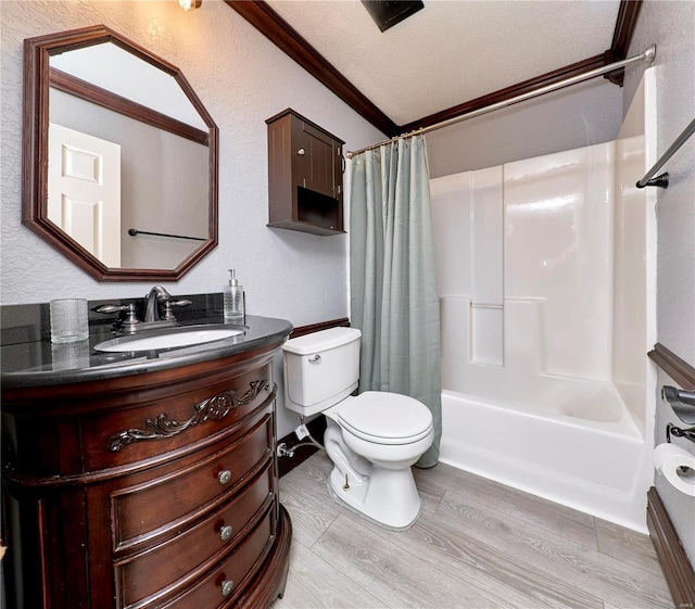 full bathroom featuring vanity, shower / tub combo, crown molding, hardwood / wood-style flooring, and a textured ceiling