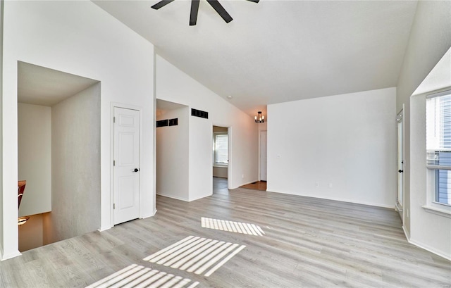 unfurnished room featuring high vaulted ceiling, a ceiling fan, visible vents, and light wood-style floors