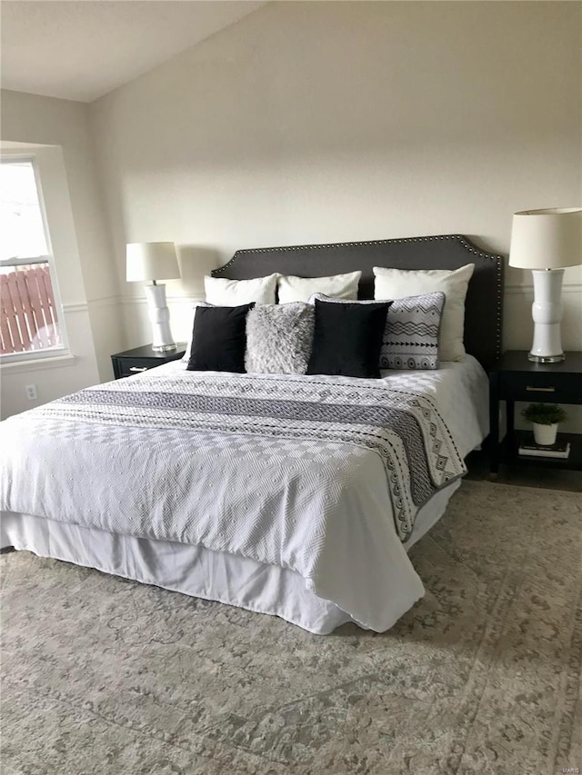 bedroom with lofted ceiling