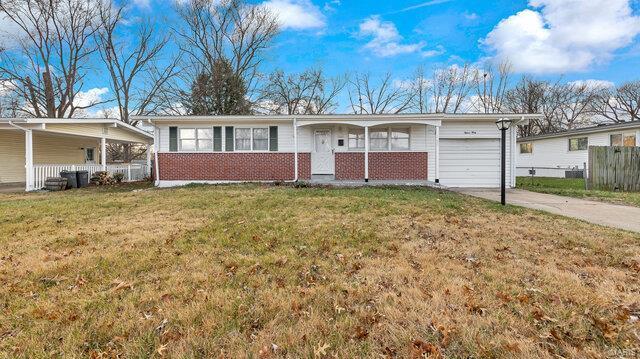 single story home with a garage and a front yard